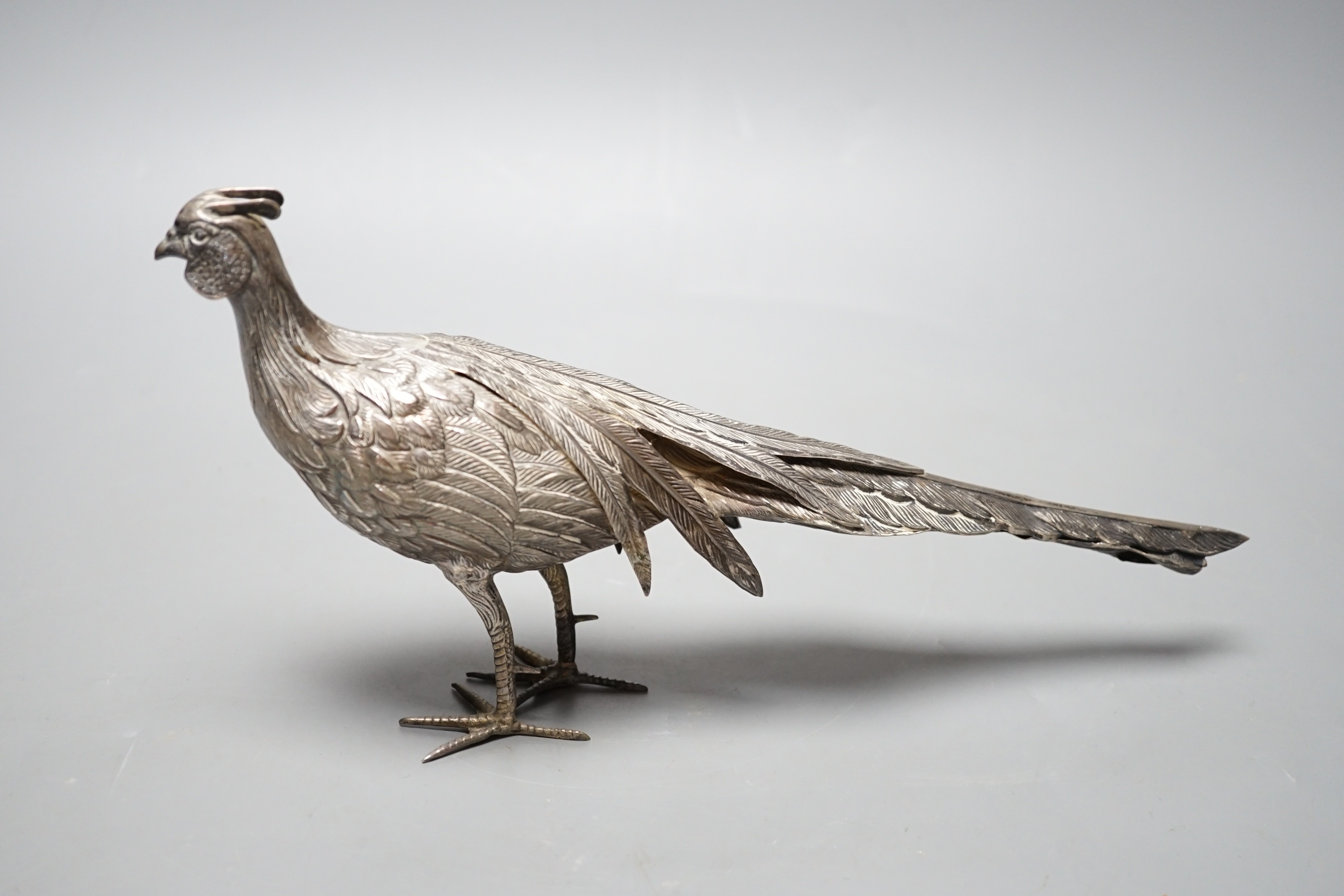 A 20th century Spanish white metal free-standing model of a pheasant, length 28.5cm, 148 grams.